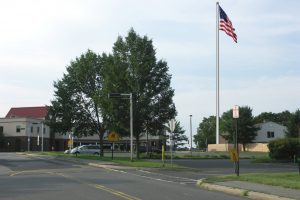 Driveway to HS, across from Church